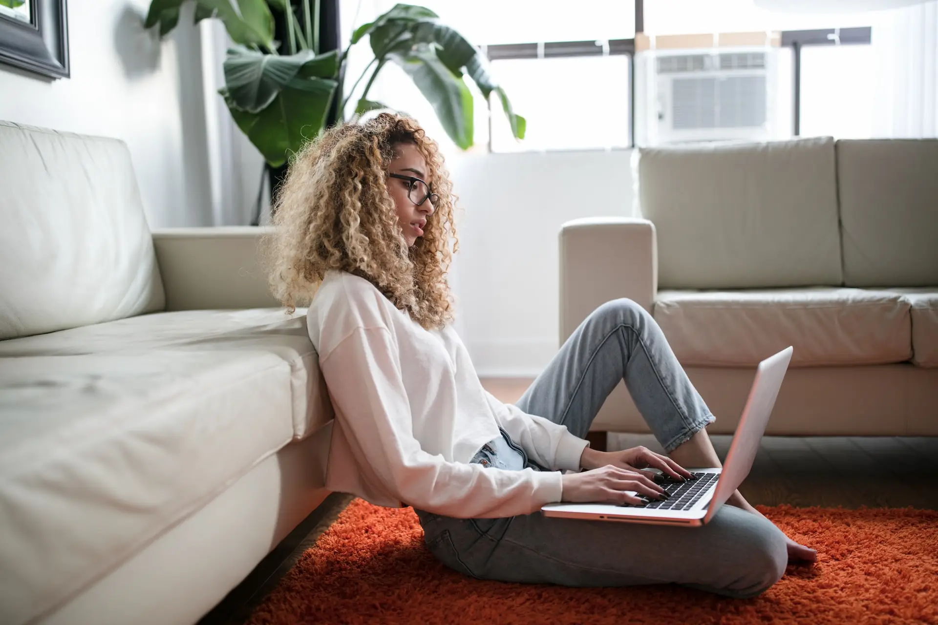 woman using laptop for real estate website